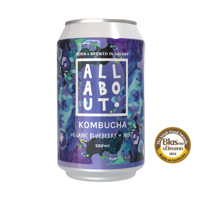 All About Kombucha 330ml can of organic blueberry and mint kombucha with bold purple design and 2024 Blas na hÉireann Gaeilge award badge