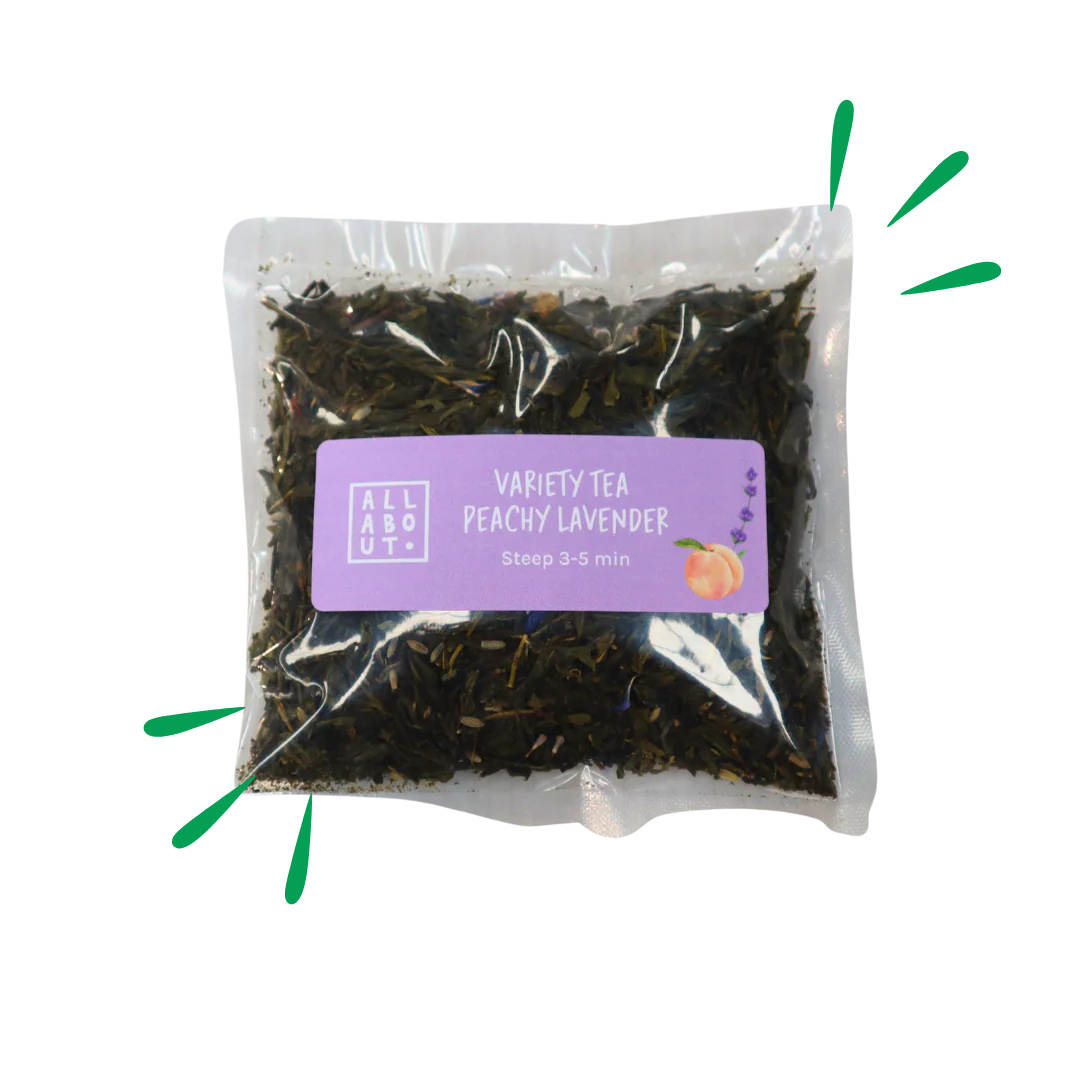 All About Kombucha variety tea pouch labeled Peachy Lavender in a clear 3–5 minute steeping pack with purple label and illustrated peach