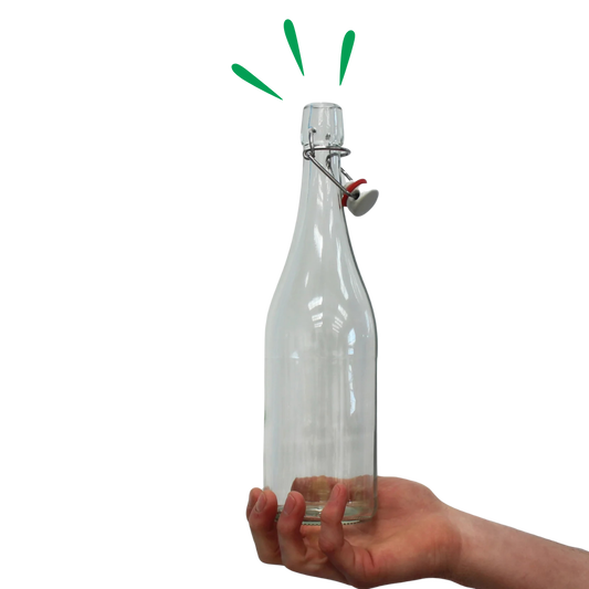 Clear swing-top glass bottle held upright in a hand, ideal for storing homemade kombucha or fermented drinks